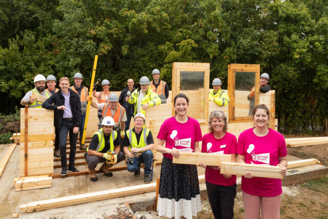 25082237 - The Barratt and David Wilson Homes team with staff at Farleigh Hospice